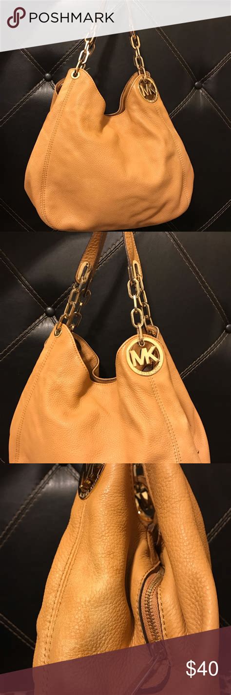 michael kors gold bag pealing